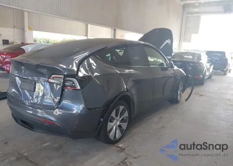 2023 Tesla Model Y Awd/Long Range Dual Motor All-Wheel Drive z USA, uszkodzony, nr VIN 7SAYGDEE4PF799452